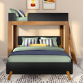 Modern wooden bunk bed full-over-twin with green and blue bedding, striped pillows, ladder and patterned rug in a contemporary kids' bedroom
