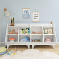 White children's bookshelf with wooden toys, picture books, plush cloud cushion and pastel nursery wall art — toy storage and playroom decor
