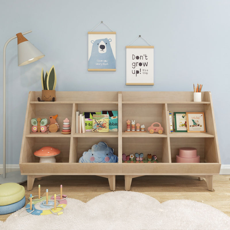 Pastel kids' playroom with wooden low bookshelf toy organizer, children's books, plush cloud pillow, stacking toys, mushroom stool, and wall art