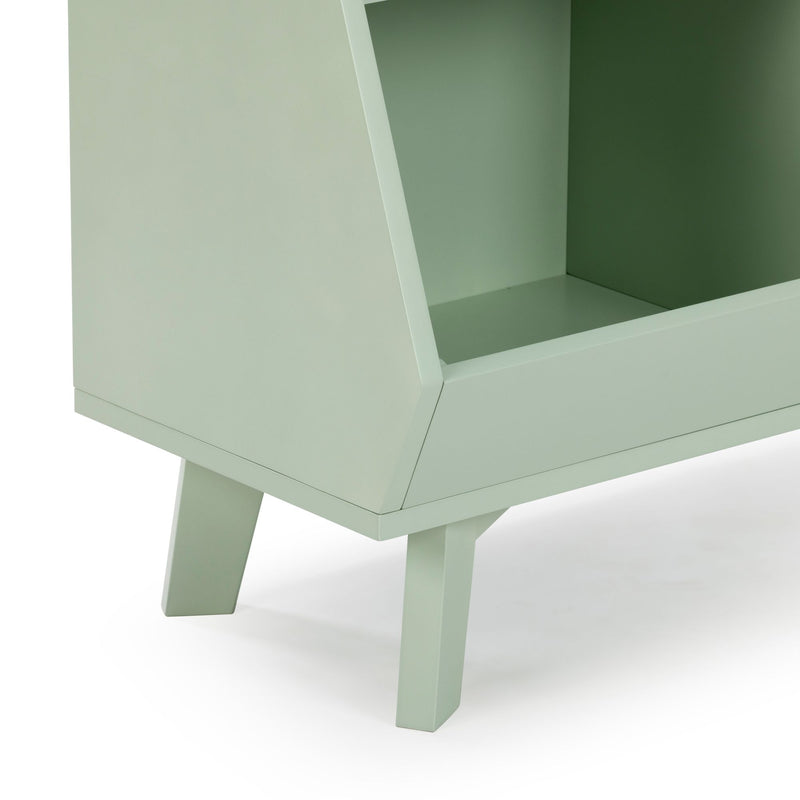 Close-up of mint green mid-century modern wooden cabinet showing angled legs and open shelf