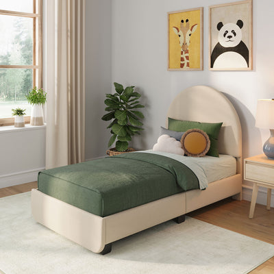 Cozy modern children's bedroom with green bedding on a beige upholstered twin bed, round and cloud pillows, panda and giraffe wall art, potted plants, wooden nightstand and soft natural light from window