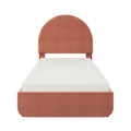 Terracotta velvet upholstered twin bed with arched headboard and white quilted mattress, modern platform bed