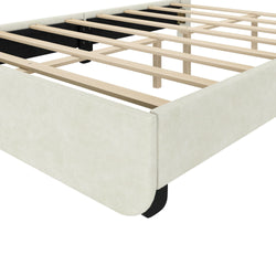 Beige upholstered platform bed frame with exposed wooden slats and black center support legs, close-up view without mattress