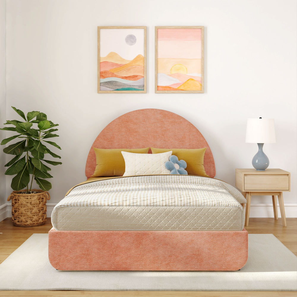 Cozy bedroom featuring a stylish pink upholstered bed with yellow and blue pillows, modern nightstand, and vibrant wall art, creating a serene and inviting space.