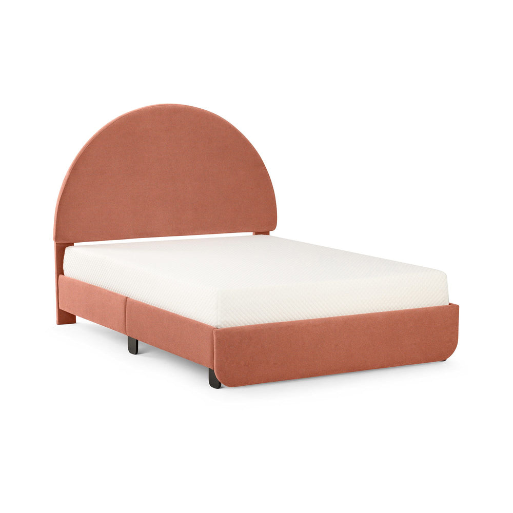 Modern upholstered bed with round headboard and white mattress in a minimalist style.