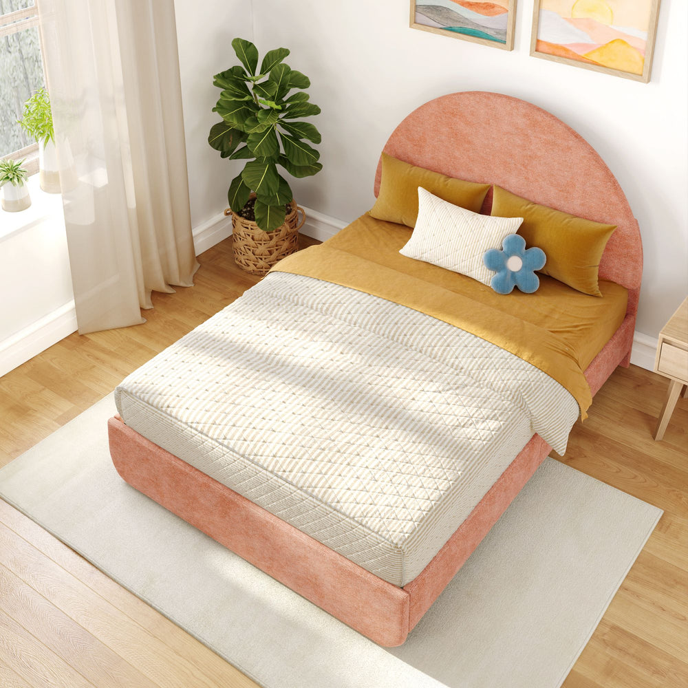 Luxurious modern bedroom with a stylish pink bed frame, cozy mustard bedding, decorative pillows, and indoor plants on hardwood flooring.