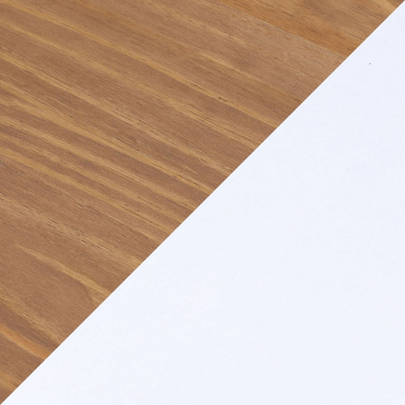 Diagonal white paper on oak wood table with warm wood grain texture — minimalist workspace background