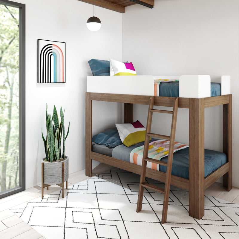 Modern kids room featuring a wooden bunk bed with colorful bedding, geometric wall art, and a potted snake plant for decor.