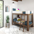 Modern wooden twin bunk bed in minimalist kids' bedroom with colorful pillows, geometric rug, framed rainbow art and potted snake plant