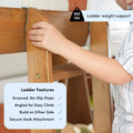 Close-up of a wooden kids bunk bed ladder with a child's hand on a grooved, no-slip, angled step showing secure hook attachment, build-on-either-side design and 200 lb weight support