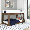 Modern wooden bunk bed for kids with ladder and twin mattresses, navy quilted bedding, colorful striped pillows, framed abstract wall art, white curtains and striped area rug in a bright contemporary bedroom