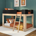 Modern wooden loft bunk bed with ladder, orange bedding and striped pillows in a kids bedroom with green textured wallpaper and framed animal prints