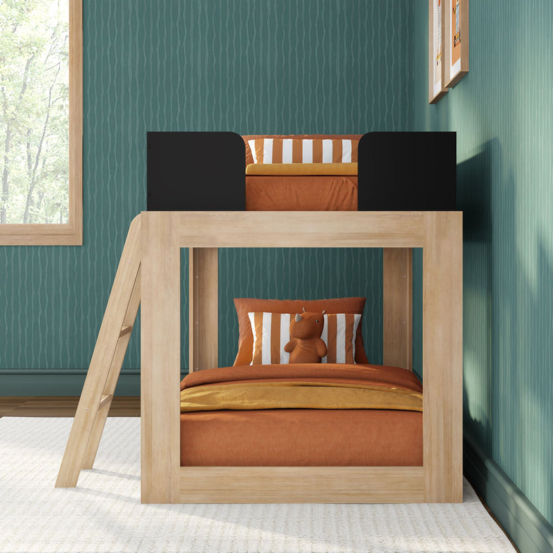 Wooden kids loft bunk bed with orange bedding, striped pillow and stuffed rhino against teal textured wallpaper