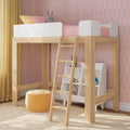 Kids wooden loft bed with ladder, pink bedding, bunny plush and built-in storage shelves against pink geometric wallpaper and yellow curtains