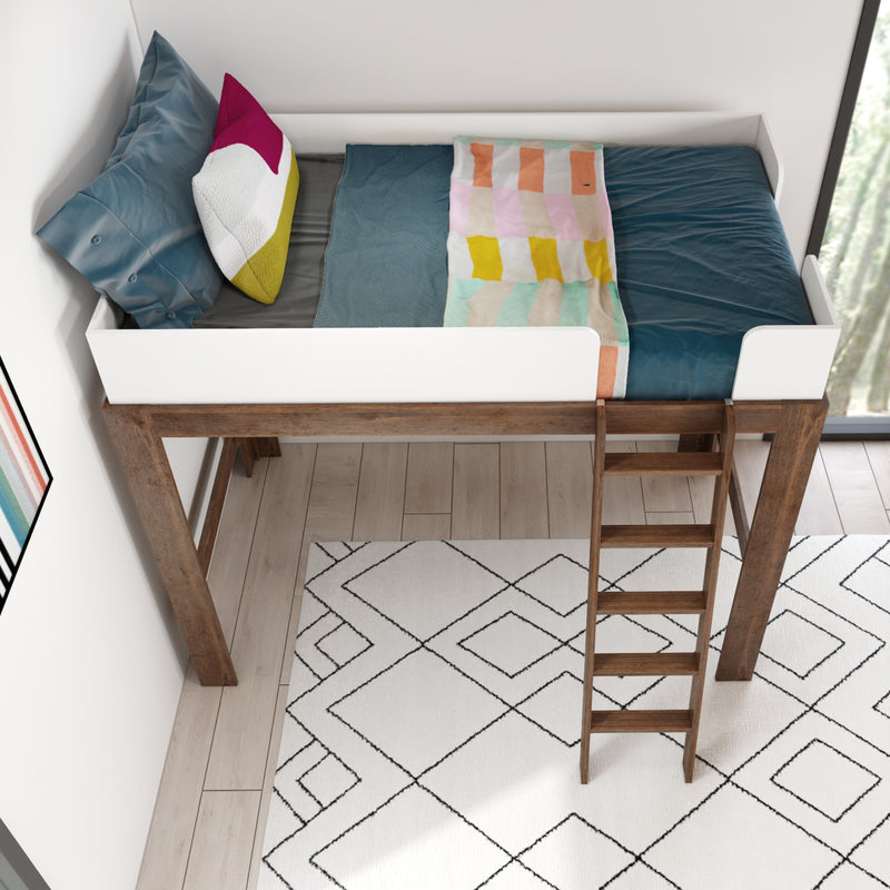 Top view of a modern wooden loft bed with white guardrail and ladder, teal sheets, colorful throw blanket and decorative pillows over a patterned rug