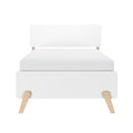 Minimalist white upholstered platform bed and headboard with light wood legs, modern Scandinavian bedroom furniture on white background
