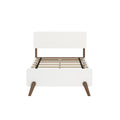 White mid-century modern platform bed frame with rounded headboard, tapered walnut legs and slatted wood mattress support