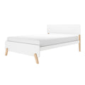 Minimalist white single bed frame with low-profile mattress and natural wood legs