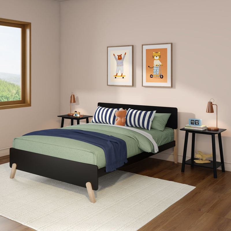 Modern kids' bedroom with green bedding, navy-striped pillows, plush toy, framed animal wall art, wooden window, bedside tables and copper lamps