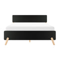 Minimalist mid-century modern black headboard bed frame with angled natural wood legs and white mattress, front view