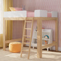 Wooden kids loft bed with ladder, pink bedding, patterned pink wallpaper, yellow curtains and toy storage shelf in a modern children's bedroom