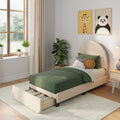 Modern kids bedroom with green bedding, upholstered storage bed with drawer, decorative pillows, indoor plants and giraffe and panda wall art