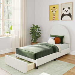 Stylish modern bedroom with single bed, green bedspread, storage drawer, indoor plant, and wildlife-themed wall art.
