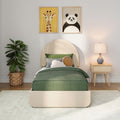 Kids bedroom decor: green bedding and round headboard, panda and giraffe framed animal wall art, woven basket plant and wooden nightstand lamp.
