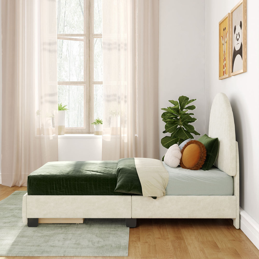 Cozy modern bedroom with a single bed featuring green and white bedding, decorative cushions, indoor plants, wall art, and a large window with sheer curtains.