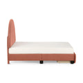 Coral upholstered platform bed with tall fabric headboard and white mattress, side view showing under-bed storage