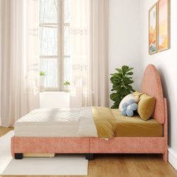 Cozy bedroom with a peach-colored upholstered bed, stylish white curtains, and a potted plant by the window.