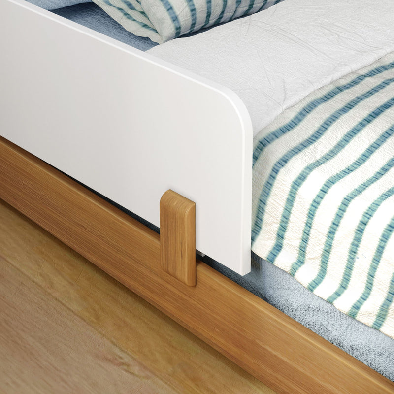 Wooden modern bed frame with blue and white striped bedding in a cozy bedroom setting.