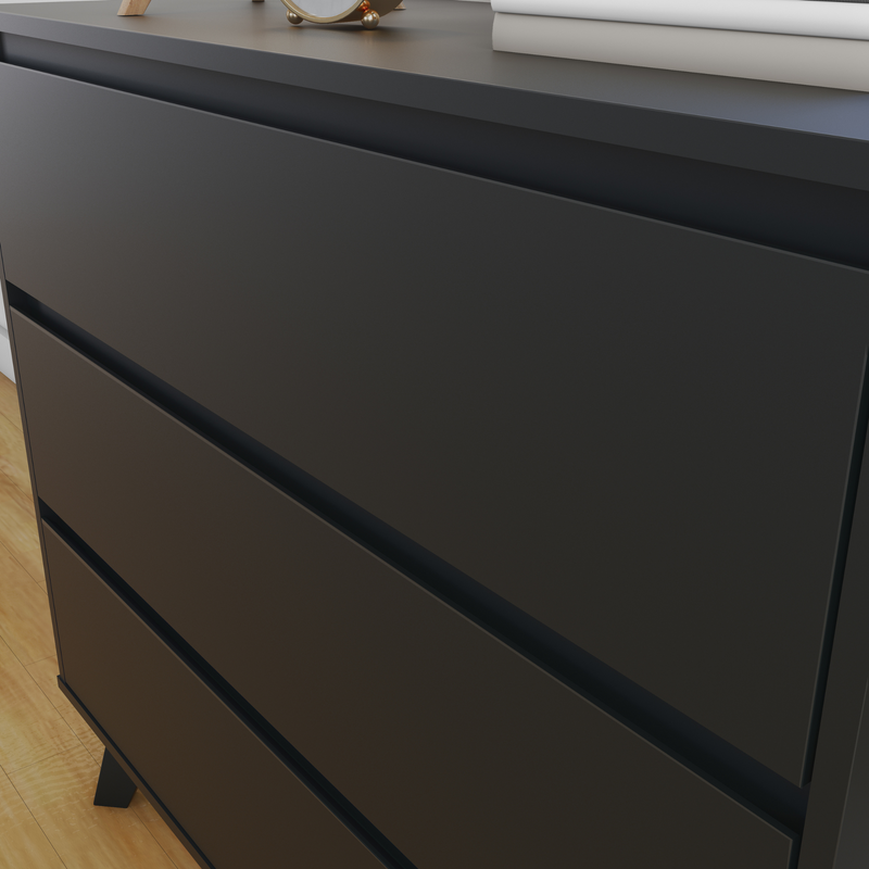 Black modern dresser with sleek drawers and minimalist design on wooden floor.
