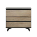 Modern mid-century three-drawer dresser in light oak veneer with matte black frame and angled legs — compact bedroom storage chest