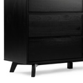 Close-up of a black wooden mid-century modern dresser — three-drawer chest with matte finish and tapered angled legs on a white background, modern bedroom storage furniture
