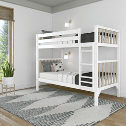 White wooden twin-over-twin bunk bed with ladder and natural wood slats in a modern minimalist bedroom, featuring neutral black-and-white bedding, wall sconces, area rug and potted plant