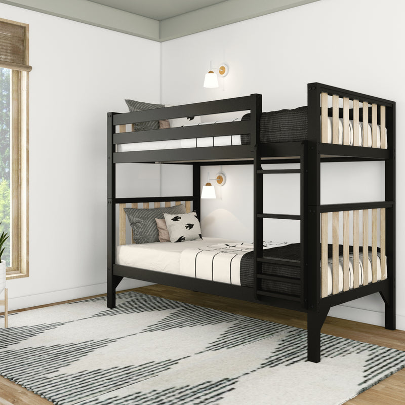 Modern black bunk bed in a cozy, minimalist bedroom setting with patterned rug and natural lighting.