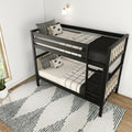 Modern black metal twin bunk bed with patterned bedding, pillows and ladder in a bright kids' bedroom