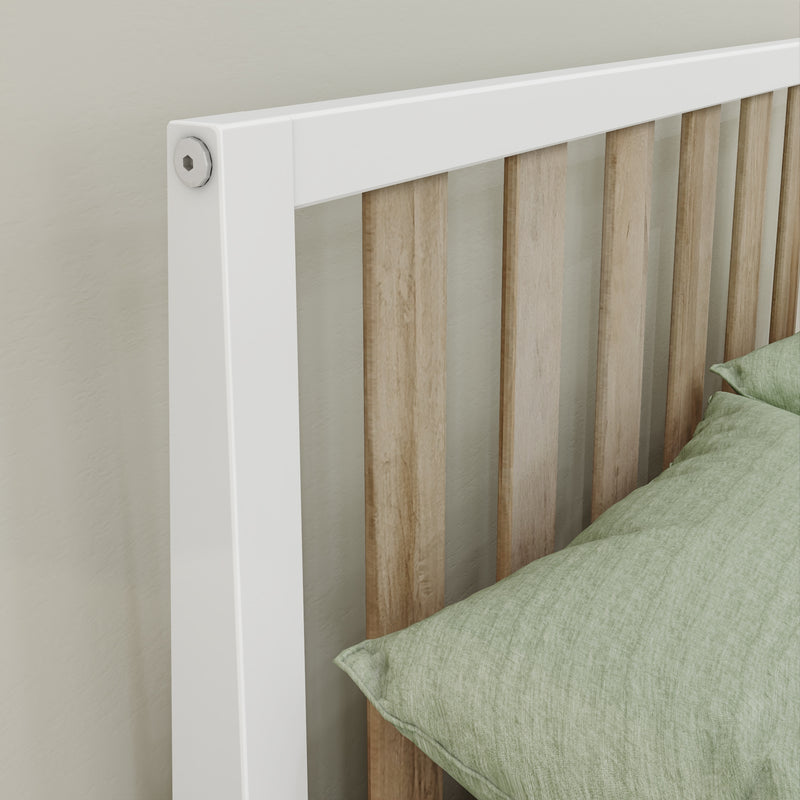 Close-up of modern wooden slat headboard with white painted frame and sage green linen pillow