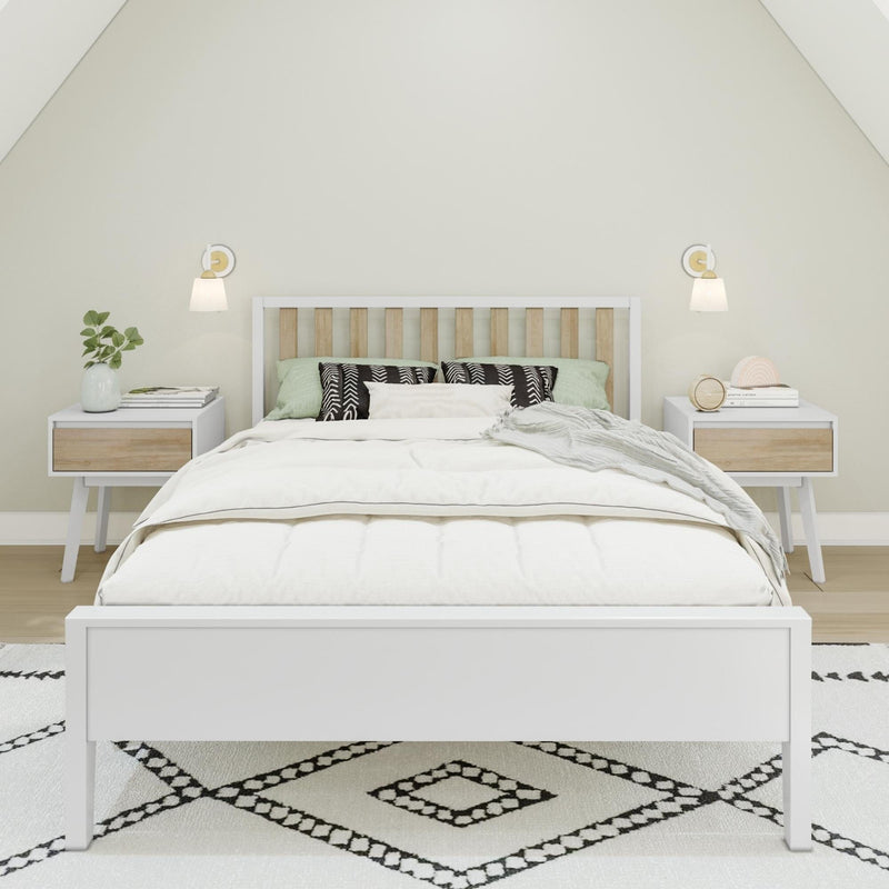 Modern bedroom with Scandinavian decor featuring a white bed, wooden headboard, and stylish bedside tables.