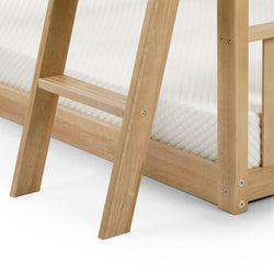 Wooden bunk bed ladder with white mattress.