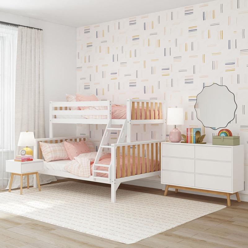 Modern kids bedroom with white bunk bed, pink bedding, and geometric wallpaper design.