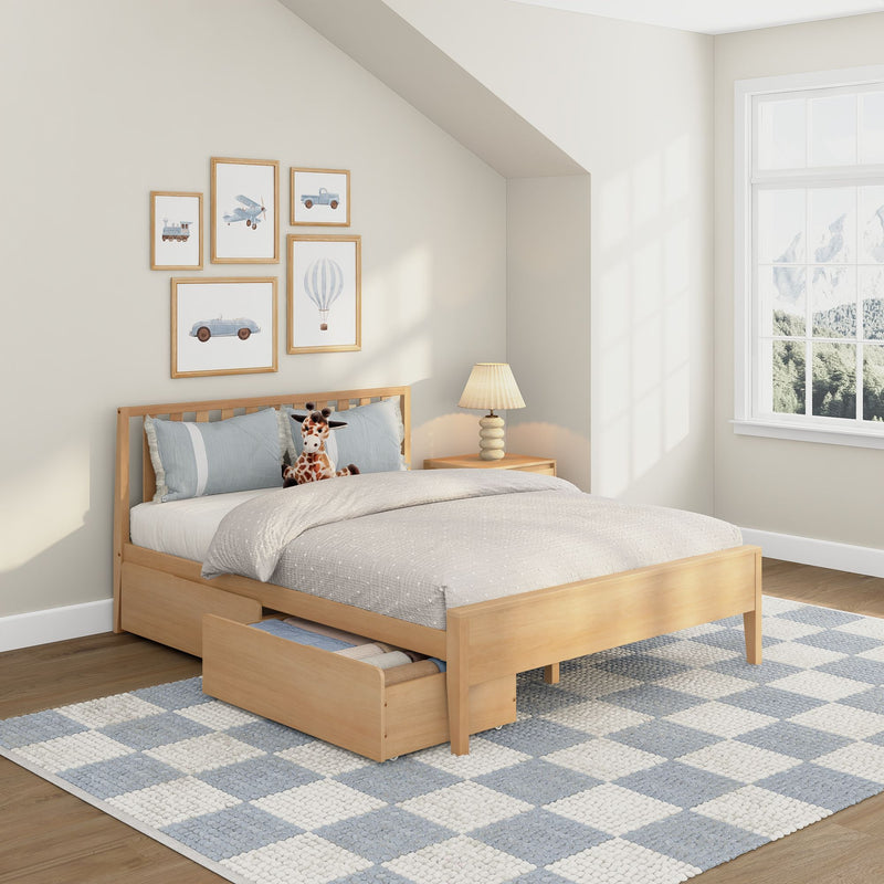 Bright kids bedroom with natural wood twin bed and under-bed storage, plush giraffe toy, blue checkered rug and framed airplane, car and hot air balloon nursery wall art by a sunlit window with mountain view