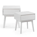Pair of white modern bedside tables with single drawer and tapered legs, minimalist wood nightstands for bedroom storage
