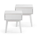 Set of two white mid-century modern bedside tables with single drawer and tapered wooden legs, Scandinavian bedroom nightstands