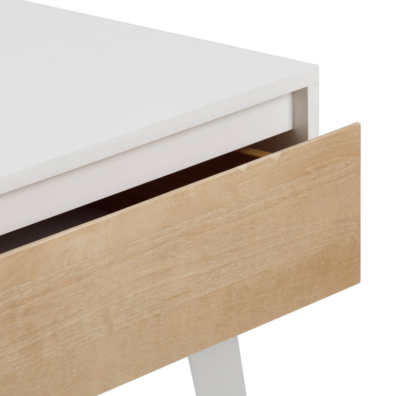Scandinavian modern nightstand with white tabletop, natural wood drawer partially open and angled white legs — minimalist bedside storage table