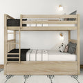 Light wood twin-over-full bunk bed with ladder and under-bed storage, black-and-white striped bedding, decorative pillows, wall sconces and patterned rug in a modern kids' bedroom