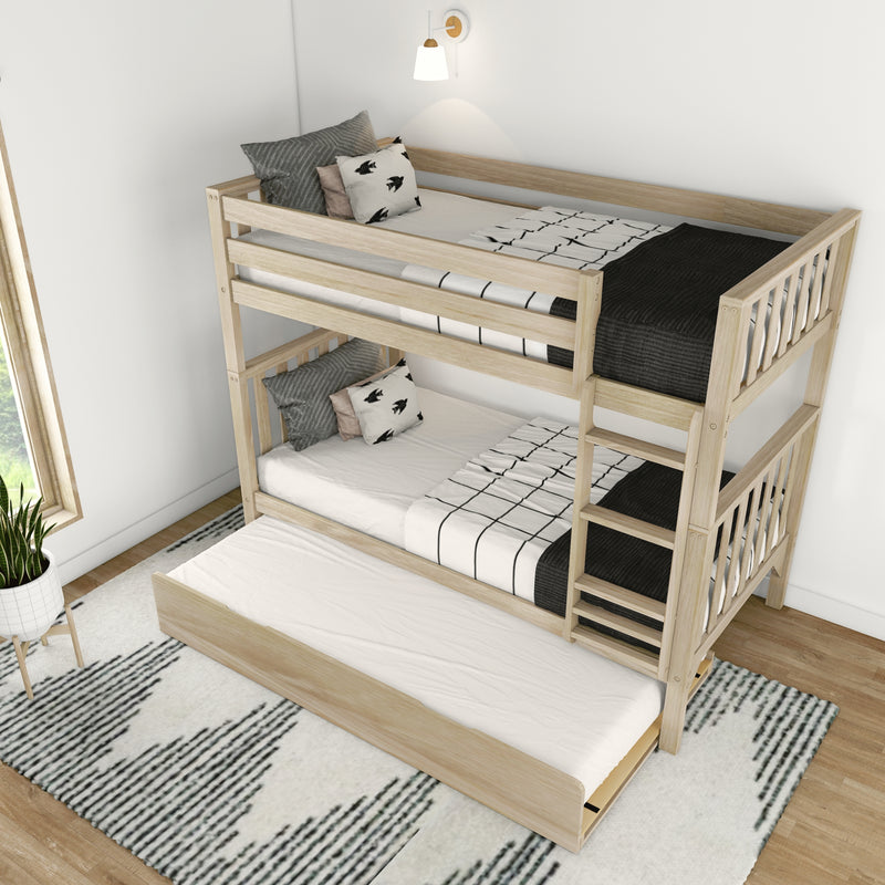 Modern wooden bunk bed with black and white bedding and pull-out trundle in a stylish bedroom setting.