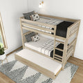 Light wood twin-over-twin bunk bed with pull-out trundle, ladder and safety rails in a modern Scandinavian kids bedroom with black-and-white bedding
