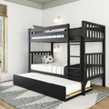 Black wooden triple bunk bed with pull-out trundle and ladder in a modern white bedroom with gray-and-white bedding, wall sconces, and patterned area rug.
